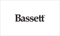 A black and white photo of the logo for bassett.